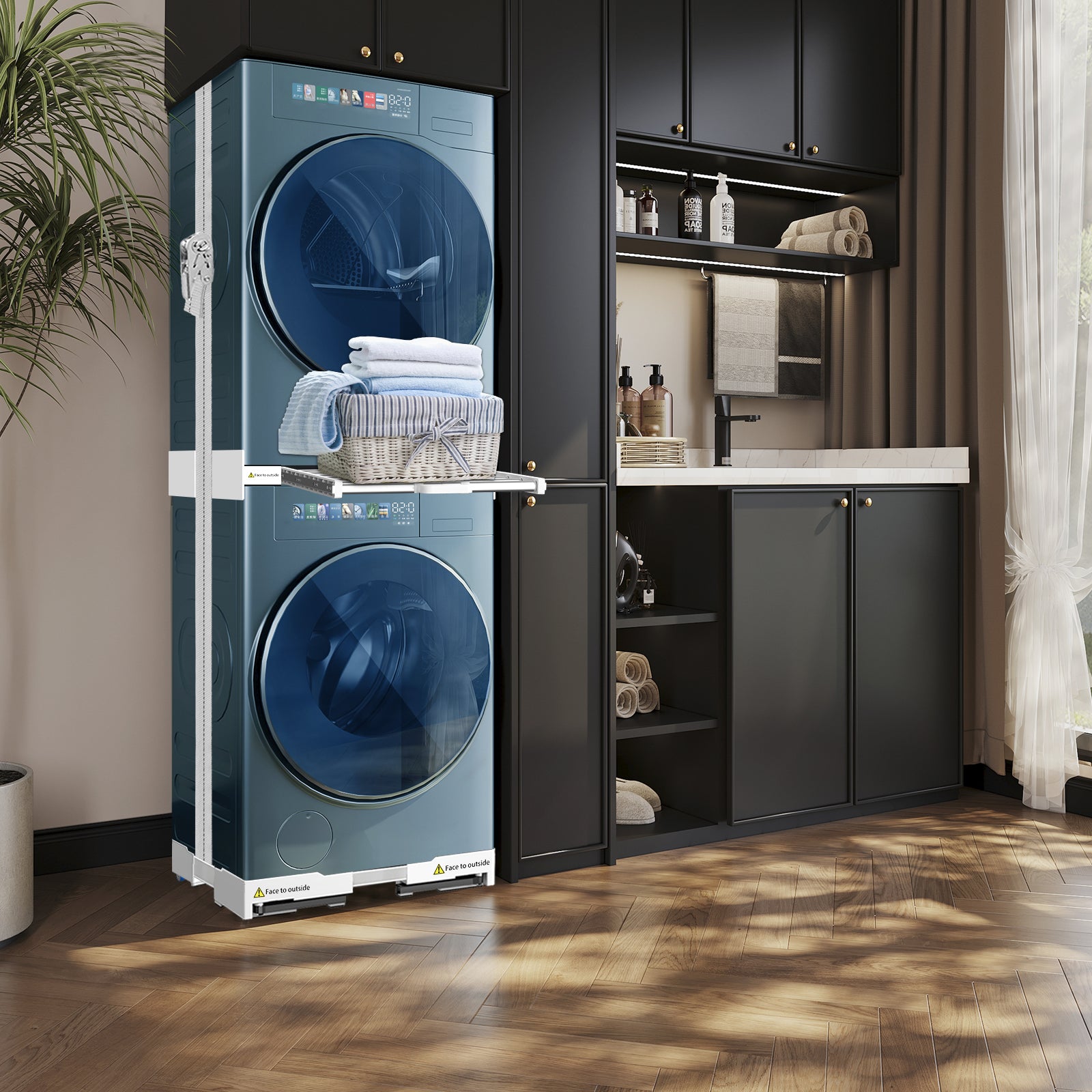 Movable base with wheels under a washing machine, part of the NIUXX universal stacking kit.